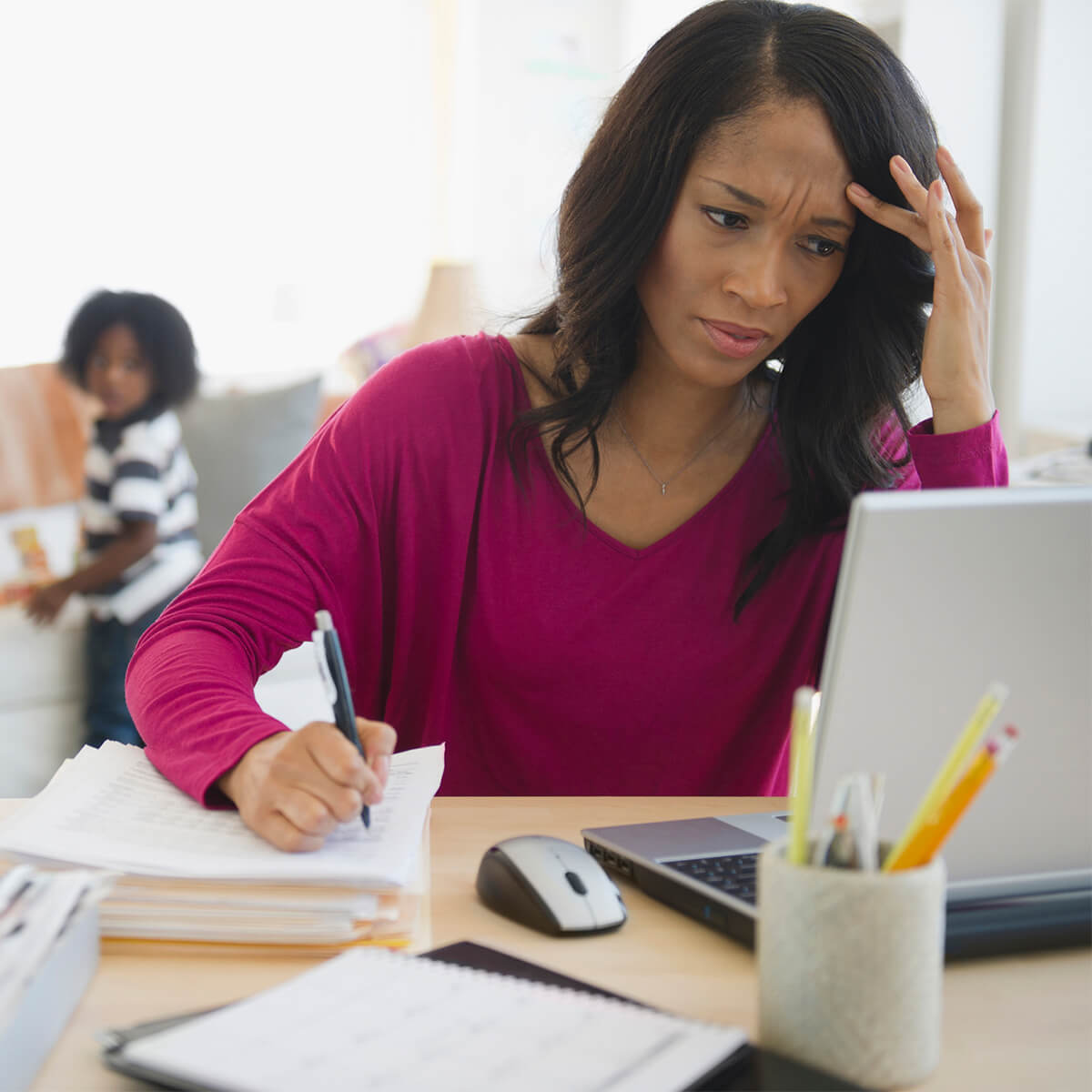 Frustrated African American woman working from home - stock photo
