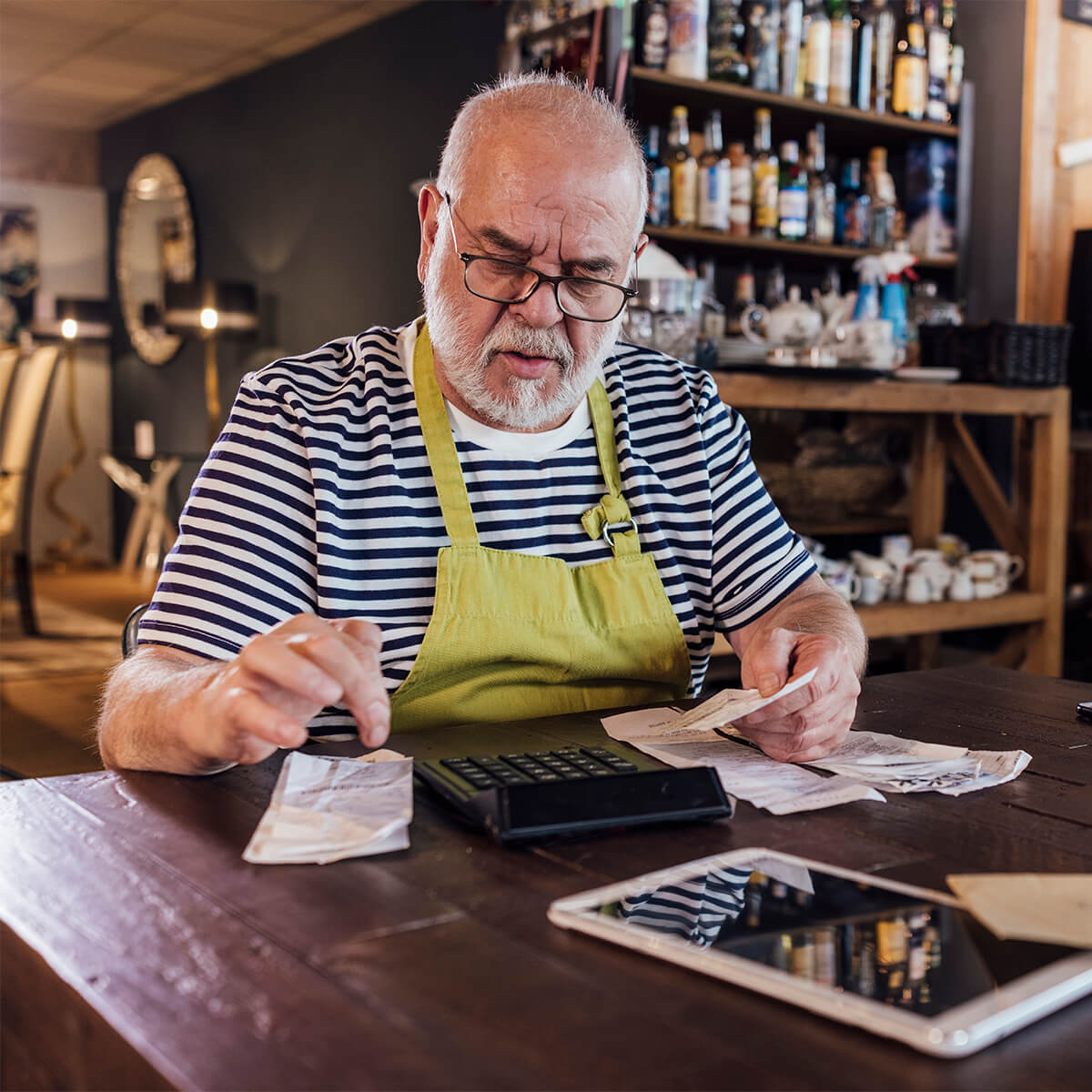 A small business owner calculates his CEBA loan repayment