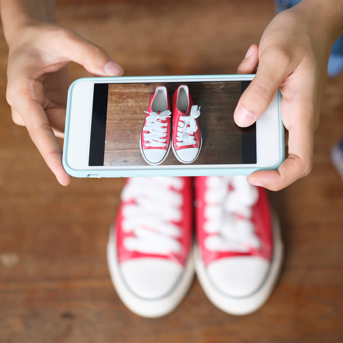 Taking photo of shoes to sell