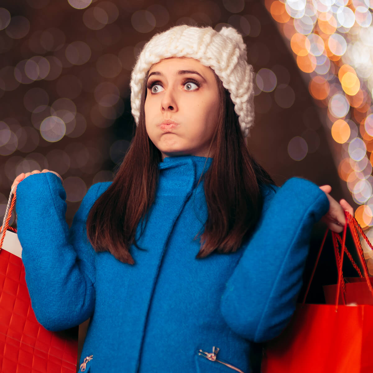 Woman carrying holiday shopping bags