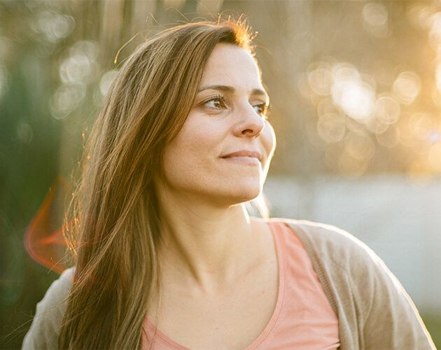 Optimistic woman looking hopeful