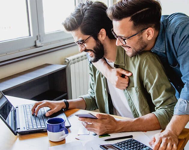 Young men budgeting together