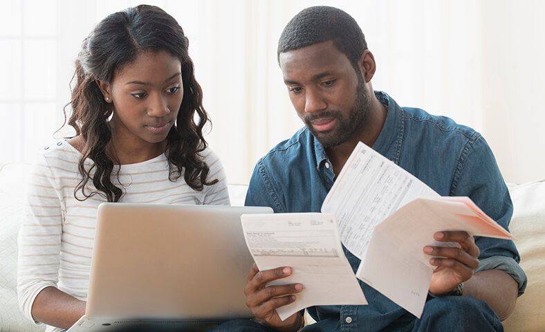 man and woman reviewing finances